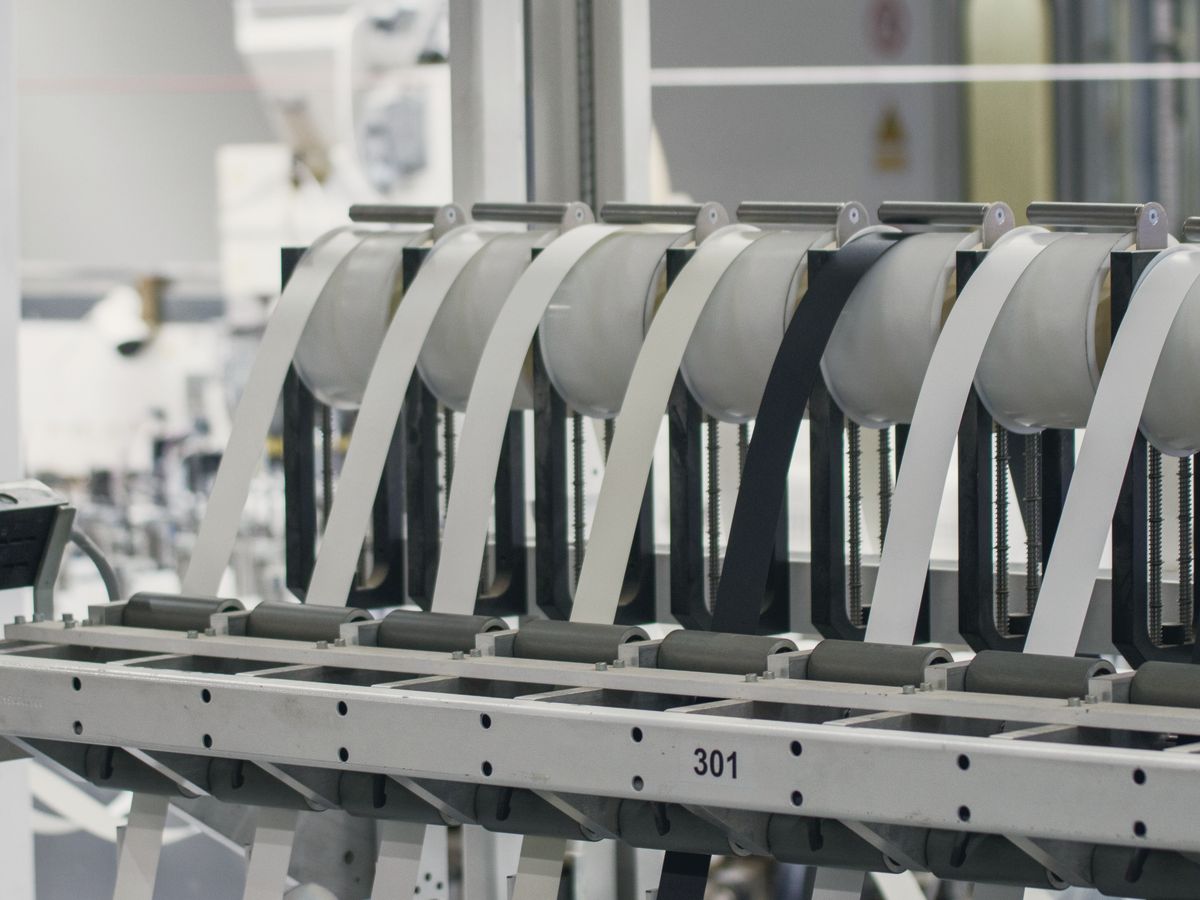 Manufacturing machinery on a bright factory floor.